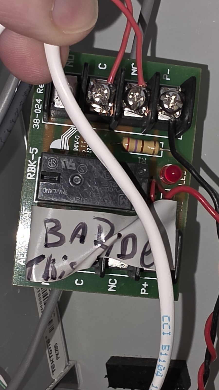 An Altronix power supply board, 6V/12V/24V jumper table visible, powering the intercom.