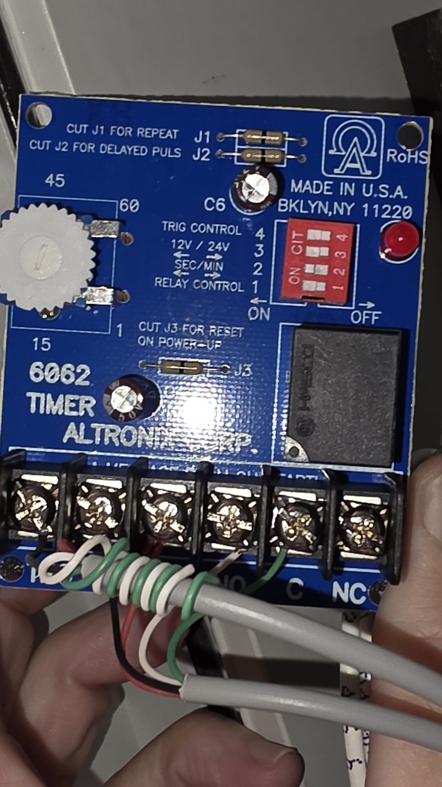 An Altronix 6062 timer board in the entry system, terminal wiring intact.